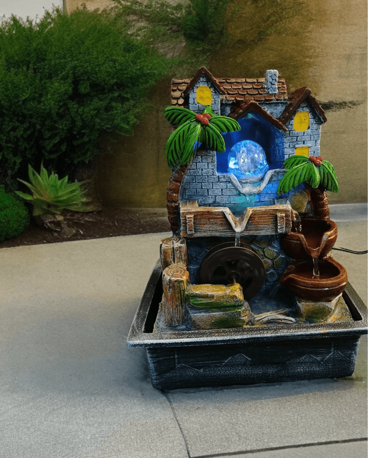 Nature-Inspired Crystal Ball Water Fountain with Hut and Wheel Accents