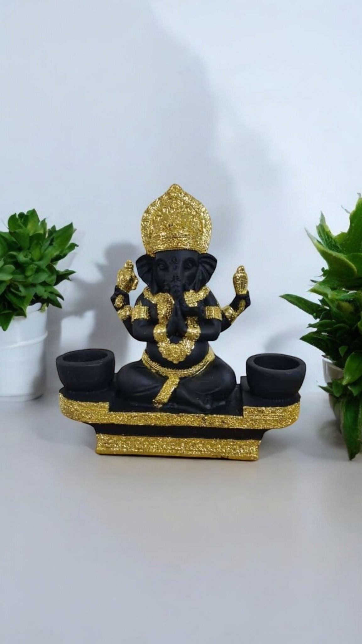 Black Lord Ganesha statue with luxurious gold-plated accents.