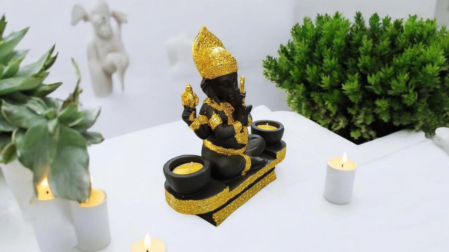 Black Lord Ganesha statue with luxurious gold-plated accents.