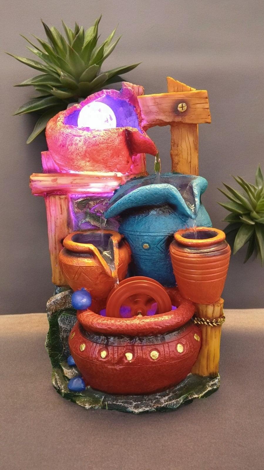 Vibrant Red-Orange Water Fountain with Clay Pots and Moving Wheels