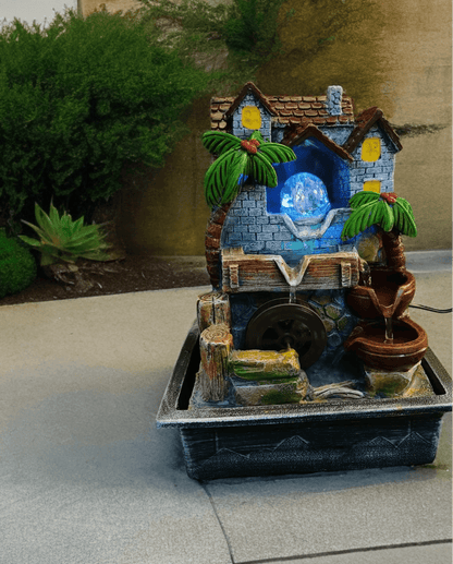 Nature-Inspired Crystal Ball Water Fountain with Hut and Wheel Accents