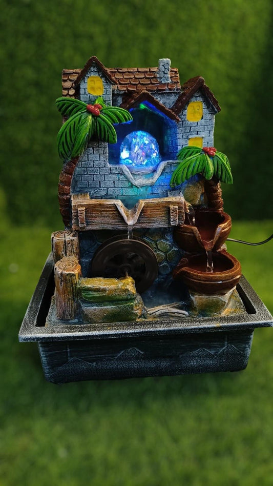 Nature-Inspired Crystal Ball Water Fountain with Hut and Wheel Accents