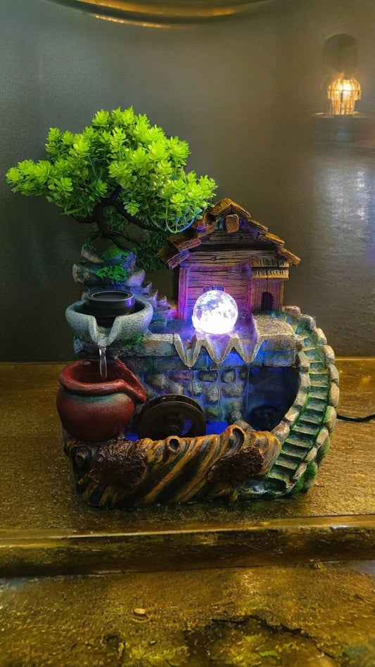 Elegant Nature Fountain with Spinning Wheels and Crystal Ball