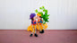 Cute Kissing Couple with Hanging Legs Sitting on the Wall
